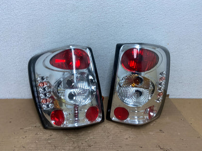 1999-2004 Jeep Grand Cherokee Left + Right Set Chrome Tail Lights AD4367 DG0