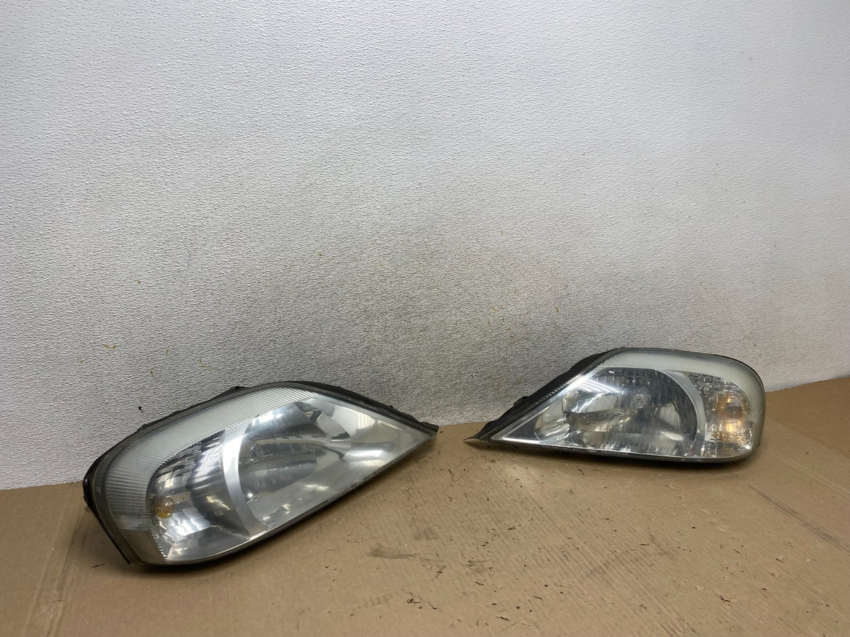 2000 to 2005 Mercury Sable Left+Right Side Halogen Headlights AJ2144 DW2