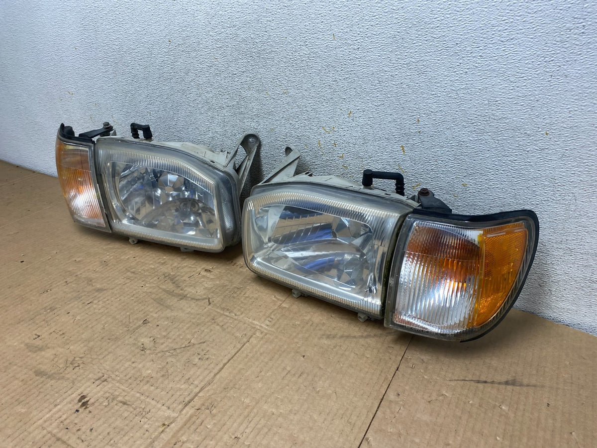 1999-2004 Nissan Pathfinder Left+Right Side Set Halogen Headlights AI7822 DW1