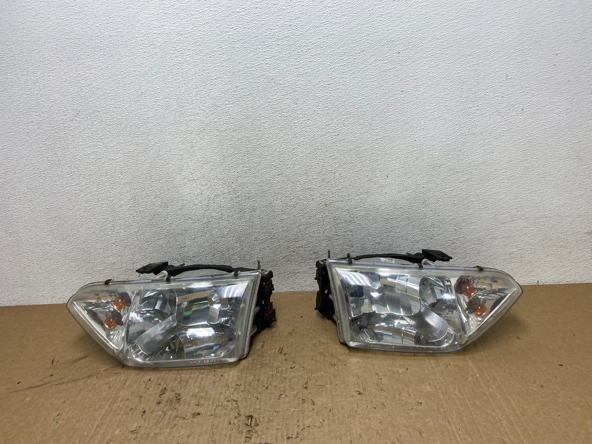 2001 to 2002 Nissan Quest Left+Right Side Halogen Headlights AG1370 DW0