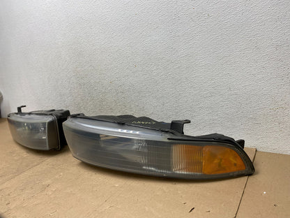 2002 to 2003 Mitsubishi Galant Left+Right Side Headlights AG4707 DW2