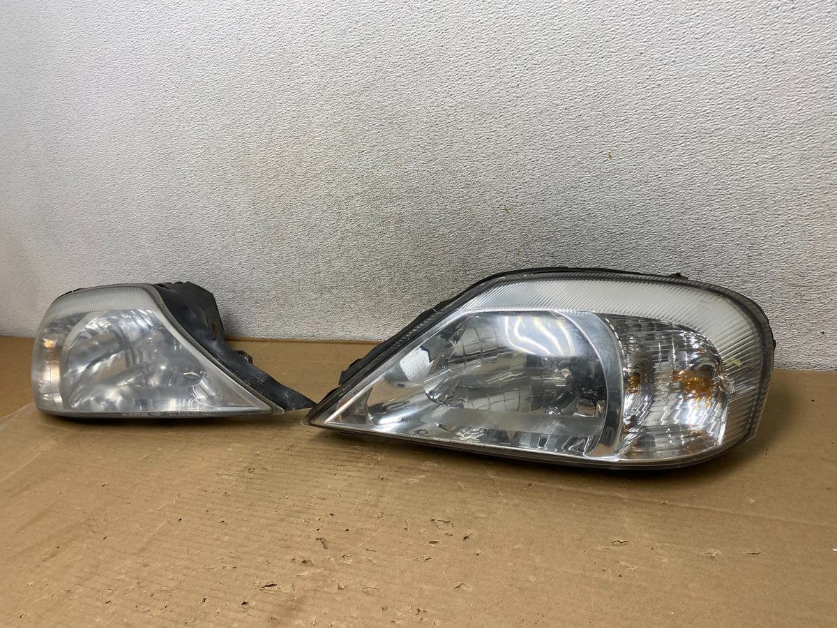2000 to 2005 Mercury Sable Left+Right Side Halogen Headlights AG9233 DW2