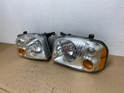 2001 to 2004 Nissan Frontier Left+Right Halogen Headlights AE6473 DW1