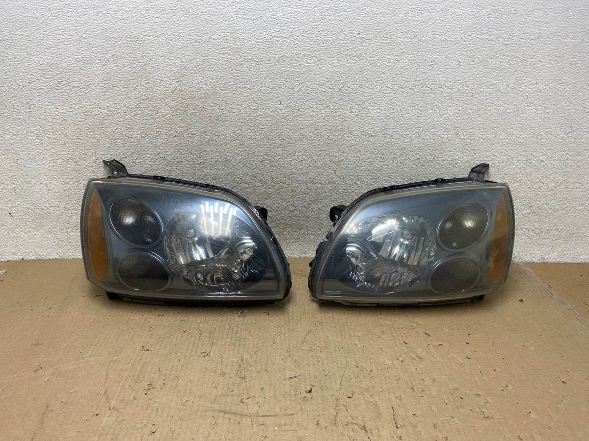 2004 to 2009 Mitsubishi Galant Left+Right Headlights Halogen AH7650 DW0