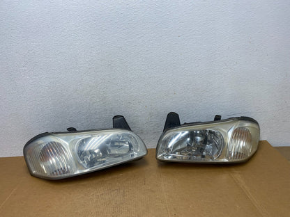 2000 to 2001 Nissan Maxima Left+Right Side Set Halogen Headlights AD9164 DW0