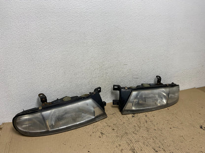 1993 to 1997 Nissan Altima Left+Right Side Set Halogen Headlights AF7256 DG2