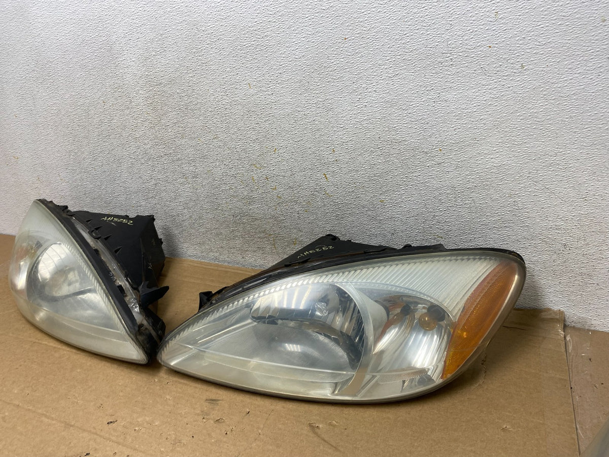 2000 to 2007 Ford Taurus Left+Right Side Halogen Headlights AH8252 DW1