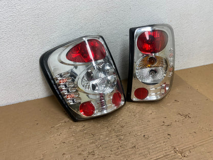 1999-2004 Jeep Grand Cherokee Left + Right Set Chrome Tail Lights AD4367 DG2