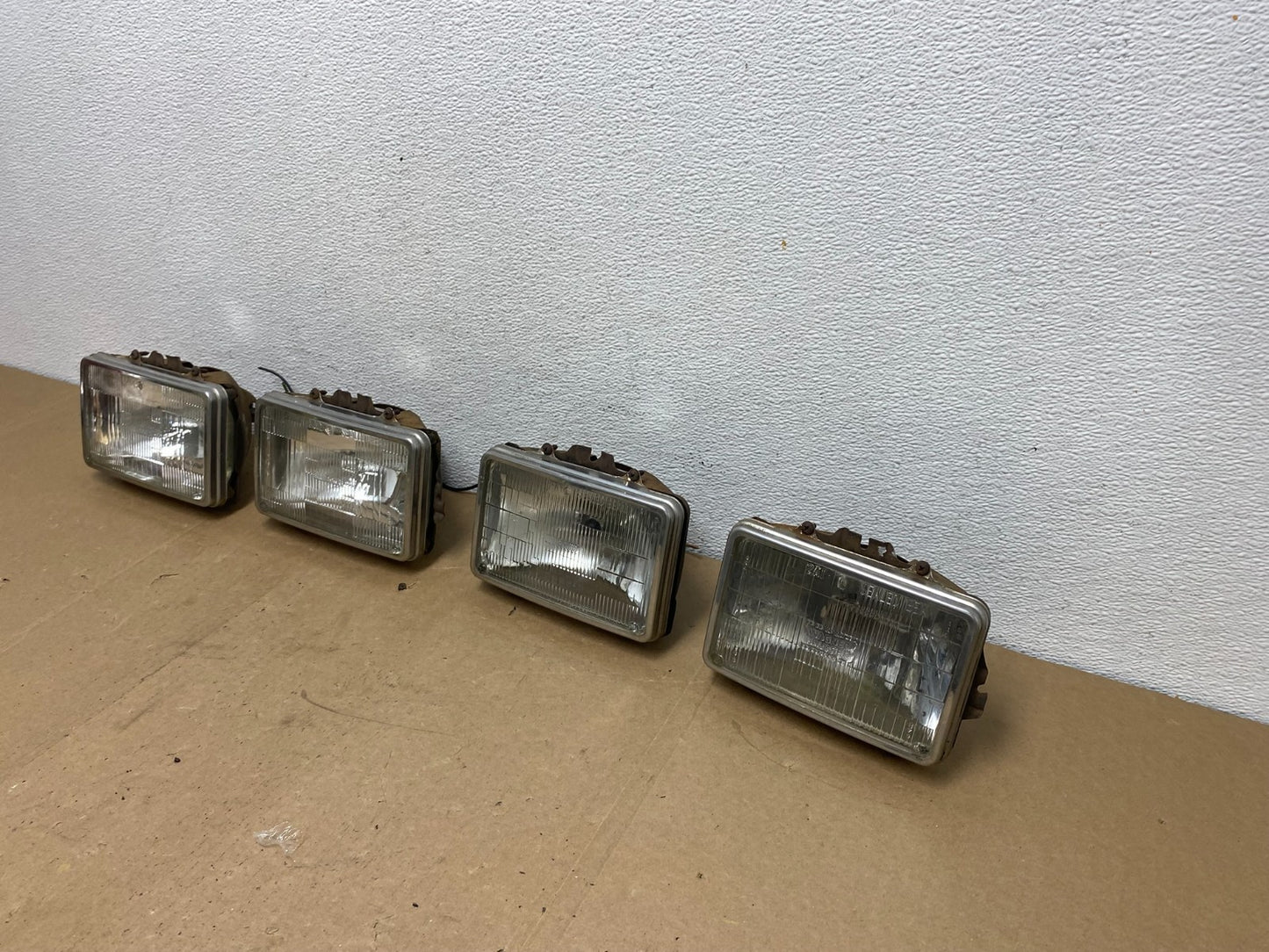 1984 to 1985 Pontiac Sunbird Left+Right Side Headlights AC56561