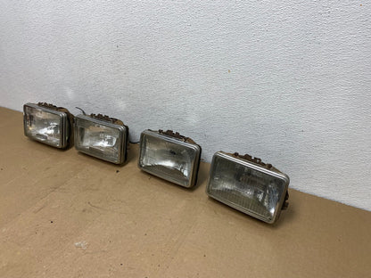 1984 to 1985 Pontiac Sunbird Left+Right Side Headlights AC56561