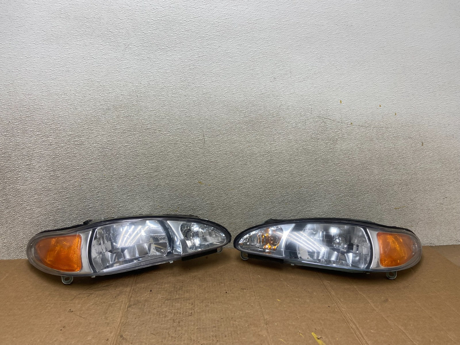 1998 to 2003 Ford Escort Left+Right Set Halogen Headlight Aftermarket AA1630 DG0