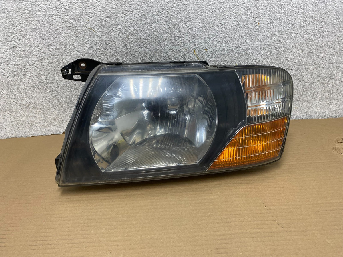 2000 to 2004 Mitsubishi Montero Pajero Left Driver LH Headlight AG9311 DW0