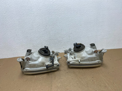 1999-2004 Nissan Pathfinder Left+Right Side Set Halogen Headlights AC5822 DW6