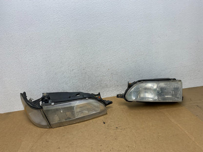 1993 to 1997 Toyota Corolla Left+Right Side Headlights AE3226 DW0