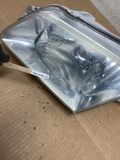 1999 to 2000 Mazda Protege Left Driver LH Side Headlight OEM Y8525 DW4