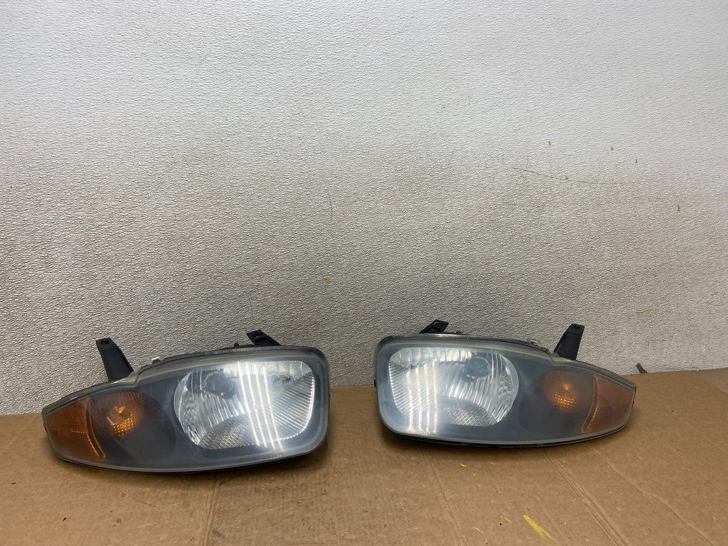 2003 - 2005 Chevrolet Cavalier Right+Left Black Headlight AA1441 PS0