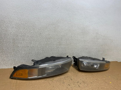 2002 to 2003 Mitsubishi Galant Left+Right Side Headlights V5990 DW2