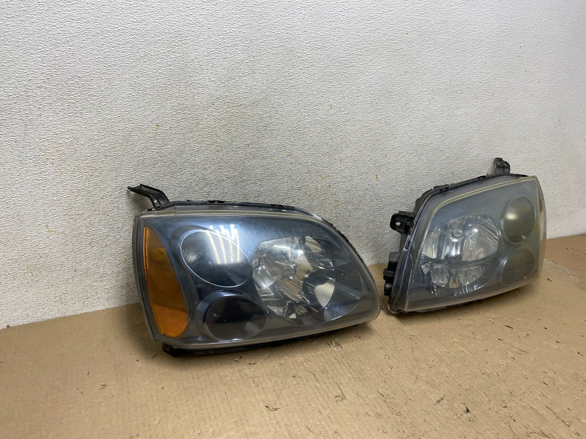 2004 to 2009 Mitsubishi Galant Left+Right Headlights Halogen AH7650 DW1