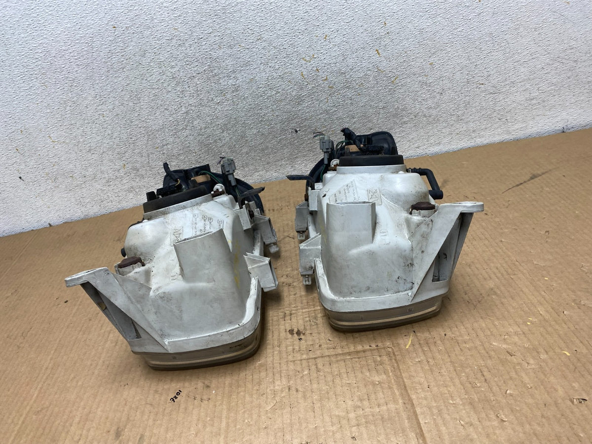 1999-2004 Nissan Pathfinder Left+Right Side Set Halogen Headlights AI7822 DW8