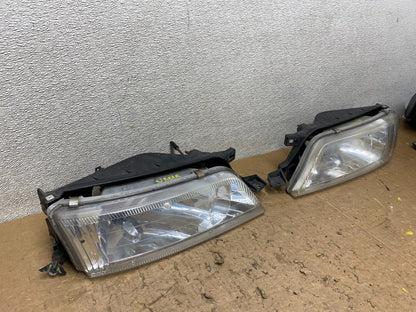 1997 to 1999 Nissan Maxima Left+Right Headlights Halogen OEM V8018 DW2