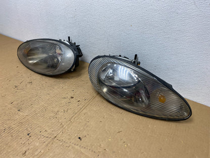 1996 to 1999 Mercury Sable Left+Right Side Set Halogen Headlights AC8121 DG1