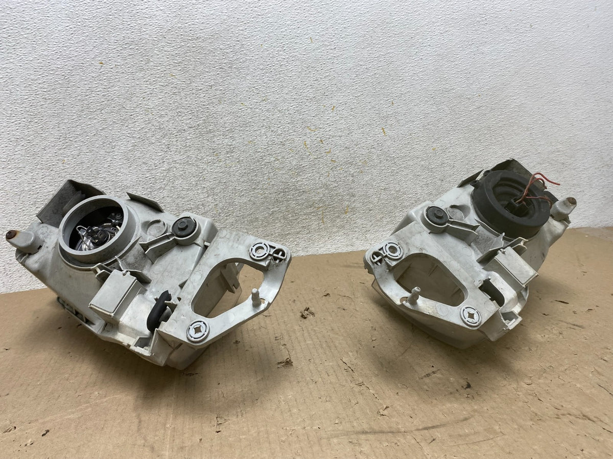 1999 to 2000 Mazda Protege Left+Right Side Headlights AH6890 DW5