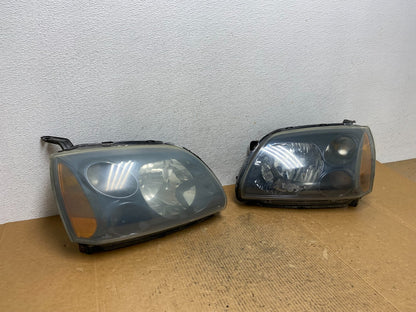 2004 to 2009 Mitsubishi Galant Left+Right Headlights Halogen AE1618 DW2