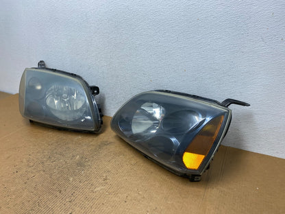 2004 to 2009 Mitsubishi Galant Left+Right Headlights Halogen AE1618 DW1