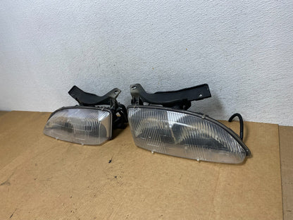 1995 to 1999 Chevrolet Cavalier Left+Right Set Halogen Headlight AE3227 DG1