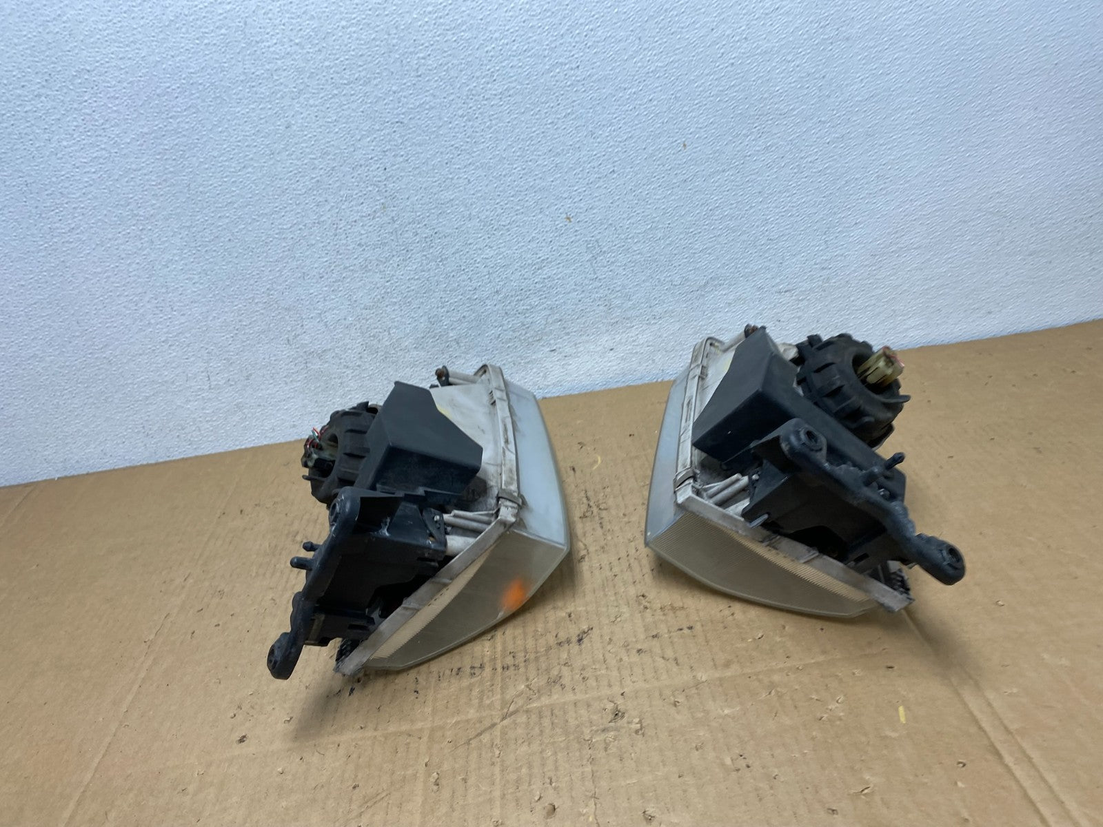 2000 to 2002 Mazda 626 Left+Right Side Headlights AD1087 DW11