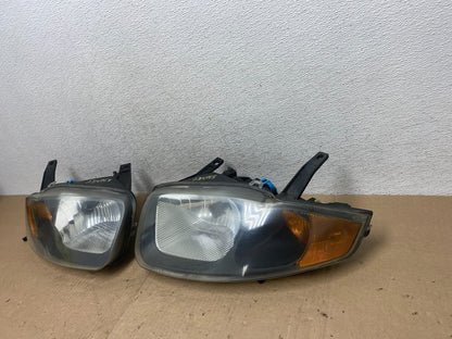 2003 - 2005 Chevrolet Cavalier Left+Right Side Black Set Headlights AG4768 DW2