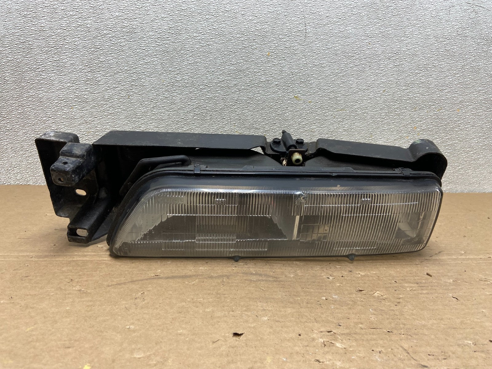 1989 to 1992 Pontiac Sunbird Left Driver Side Headlight 16509426 AB46370