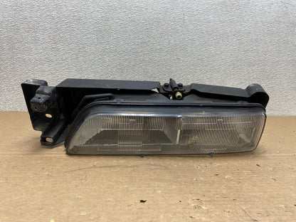 1989 to 1992 Pontiac Sunbird Left Driver Side Headlight 16509426 AB46370
