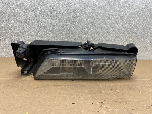 1989 to 1992 Pontiac Sunbird Left Driver Side Headlight 16509426 AB46370