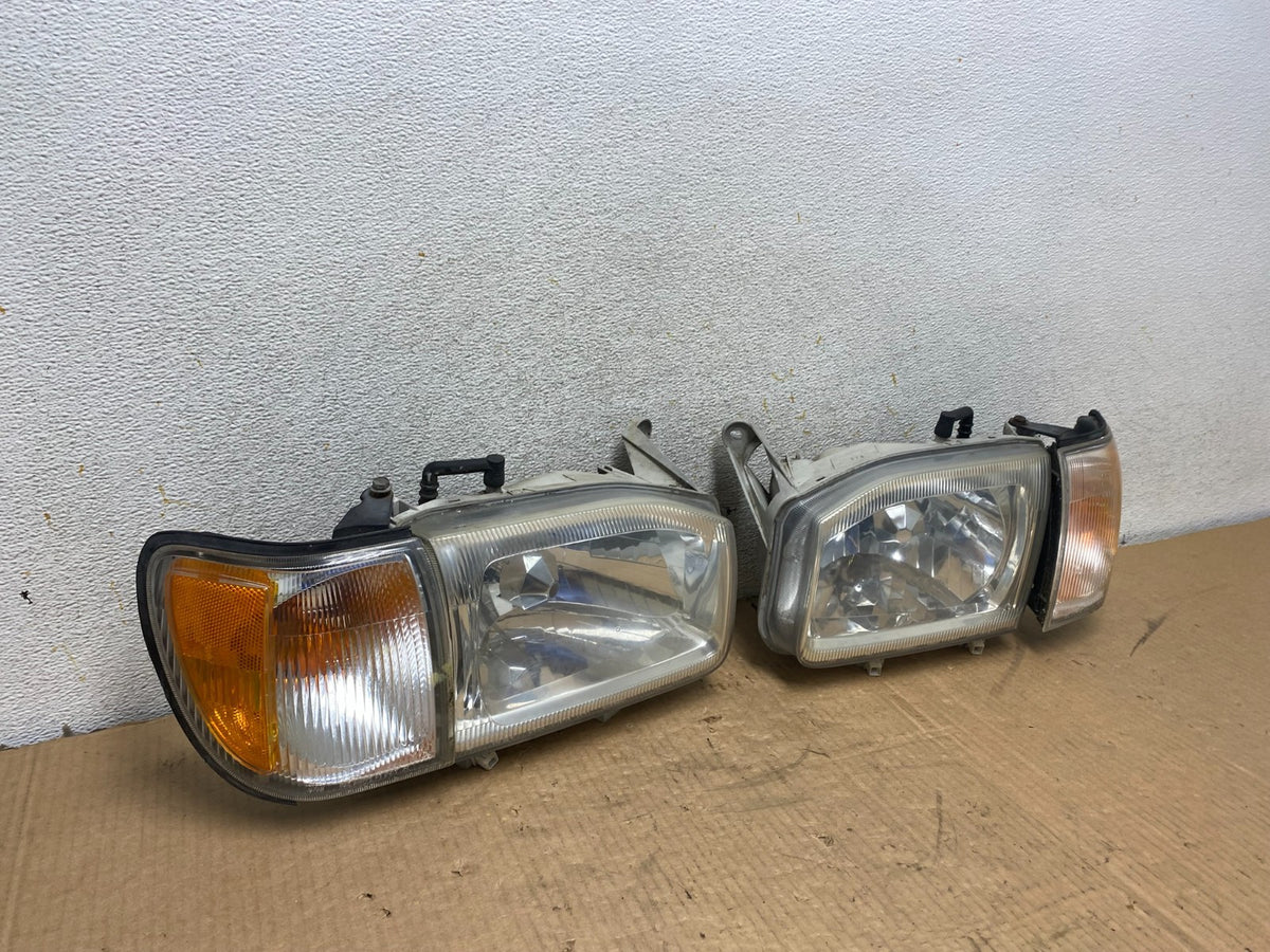 1999-2004 Nissan Pathfinder Left+Right Side Set Halogen Headlights AI7822 DW2