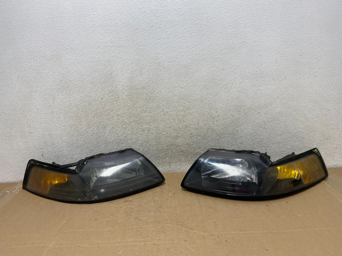 1999 to 2004 Ford Mustang Left+Right Set Side Black Headlights TYC AH9393 DW0