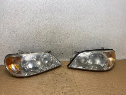 2002 to 2005 Kia Sedona Left+Right Side Headlights AI8165 DW0