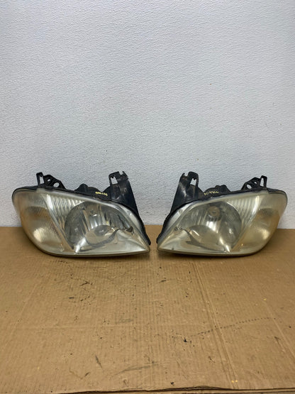 2001 2002 2003 2004 Mazda Tribute Left+Right Side Set Headlights AC7706 DW0