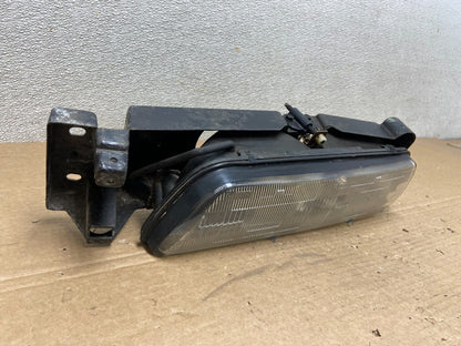1989 to 1992 Pontiac Sunbird Left Driver Side Headlight 16509426 AB46372