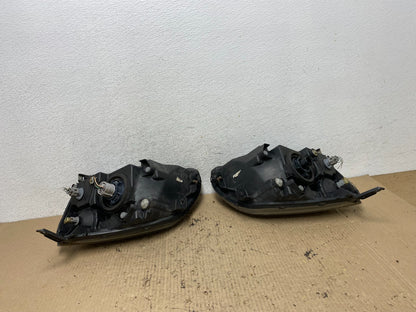2004 to 2009 Mitsubishi Galant Left+Right Headlights Halogen AF7197 DW7