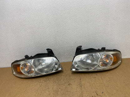2004 - 2006 Nissan Sentra Halogen Left+Right Headlights TYC AD0566 DW0