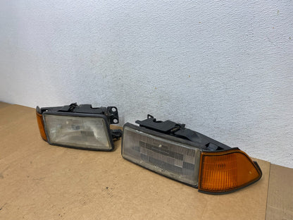 1989 to 1995 Plymouth Acclaim Left+Right Side Headlights AE3151 DW1