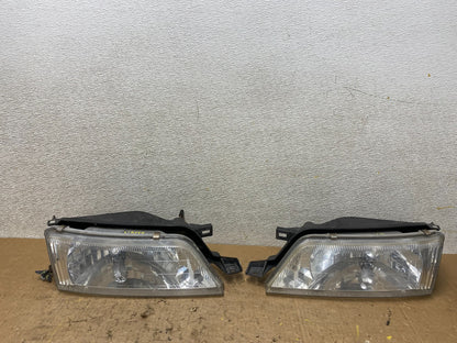 1997 to 1999 Nissan Maxima Left+Right Headlights Halogen OEM V8018 DW0