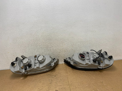 2002 to 2005 Kia Sedona Left+Right Side Headlights AI8165 DW8