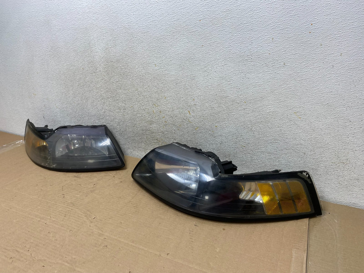 1999 to 2004 Ford Mustang Left+Right Set Side Black Headlights TYC AH9393 DW1