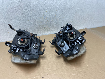 2008 to 2012 Nissan Pathfinder Halogen Headlights Left+Right AH9432 DW9