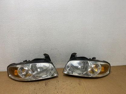 2004 - 2006 Nissan Sentra Halogen Left+Right Headlights AD2467 DW0