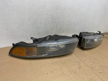 2002 to 2003 Mitsubishi Galant Left+Right Side Headlights AG4707 DW1