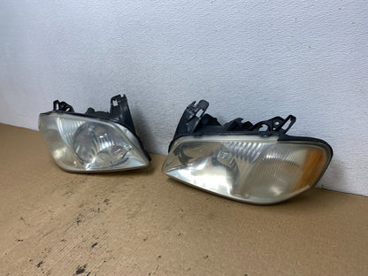 2001 2002 2003 2004 Mazda Tribute Left+Right Side Set Headlights AG2406 DW1