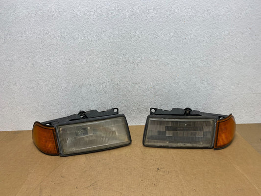 1989 to 1995 Plymouth Acclaim Left+Right Side Headlights AE3151 DW0